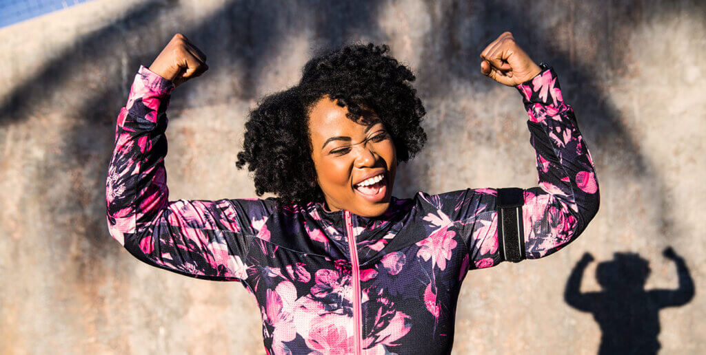 Funny portrait of a young black curvy woman during a training session